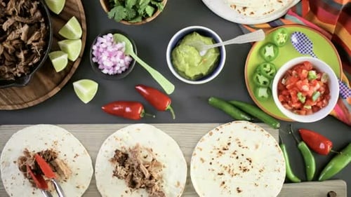 Preparing Delicious Meat Tacos with Fresh Ingredients