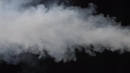 White Smoke Flowing Across Black Background