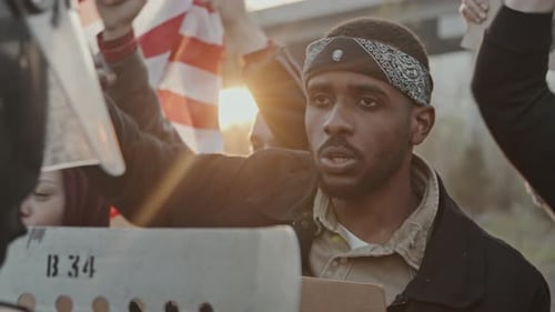 Protesters with Raised Fists and American Flag