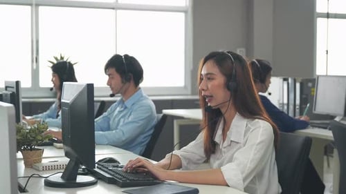 Call center young employee working with headset