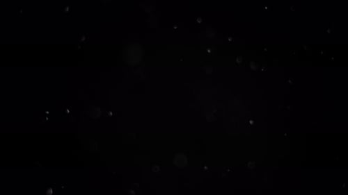 Light Specks on Black Background