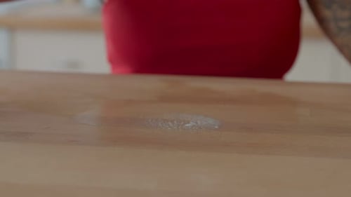 Housekeeping Woman Cleaning Table with Detergent
