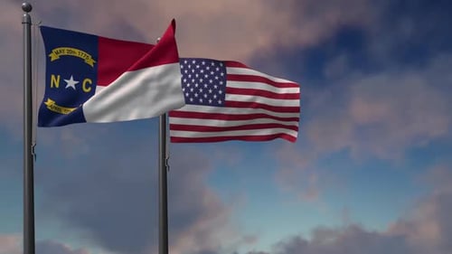 North Carolina and USA Flags Waving in Wind