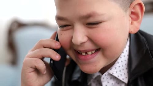 Happy Child Chatting on Smartphone