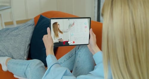 Woman on Tablet Attends Online Learning Session