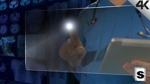 Doctor Using Tablet with Futuristic Medical Interface