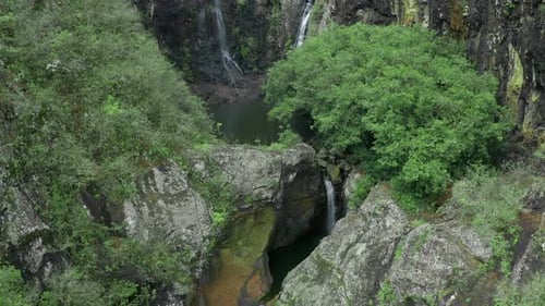 Camera is Flying Above Waterfall in Tropical Forest