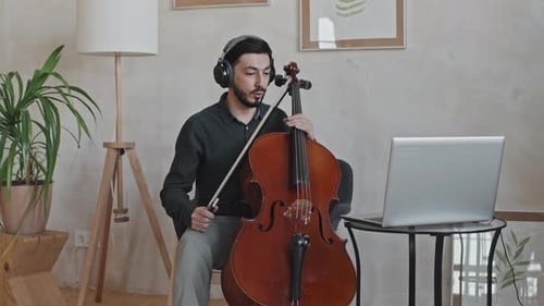 Cello Teacher Giving Online Music Lesson