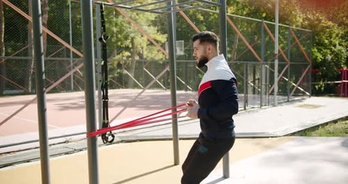 Man Working Out with Resistance Bands Outdoors