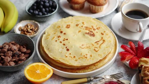 Delicious Stack of Pancakes with Berries and Coffee