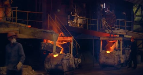 The foundry. The trolleys with the metal spark and the hot metal. It's a big factory. Metal parts.