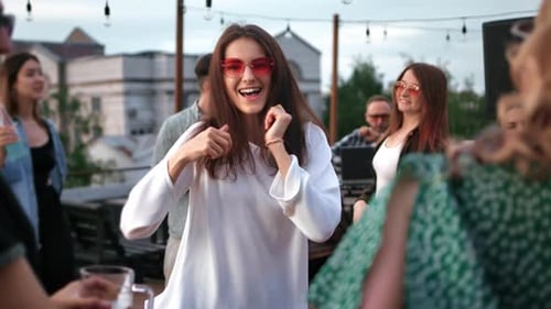 Young Adults Celebrate at Rooftop Party