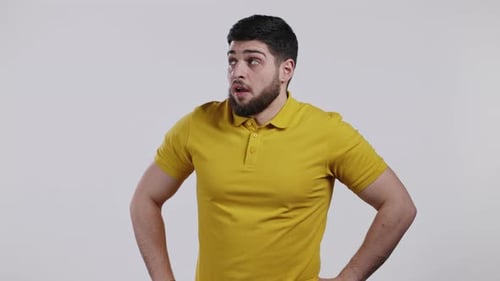 Young Adult looking Suspicious with Hands on Hips