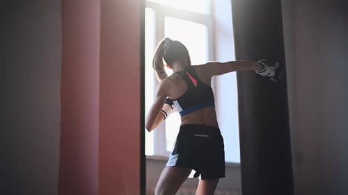 Female Fighter Trains His Punches Training Day in the Boxing Gym the Girl Trains a Series of Punches