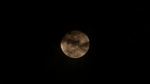 Full Moon Glowing in a Black Night Sky