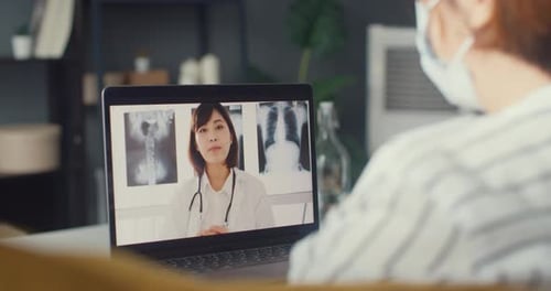 Virtual Medical Consultation with Doctor on Laptop