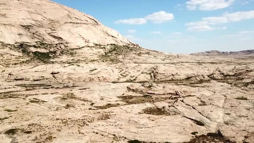 Desert Landscape With Rocky Terrain and Blue Sky