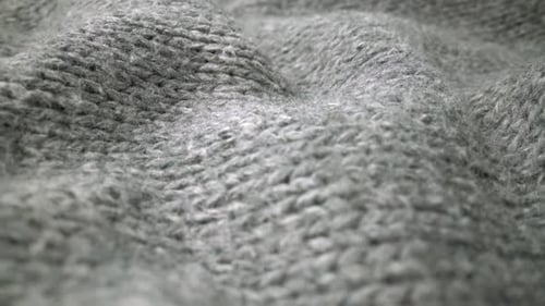 Extreme Detail View of Sheep Wool Cloth Texture Flowing in Macro Dolly Shot