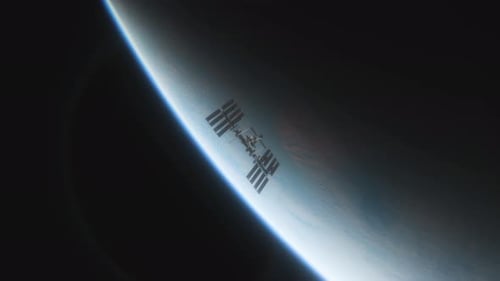 Animation of the International Space Station ISS Floating in Orbit Above Planet Earth in Outer Space