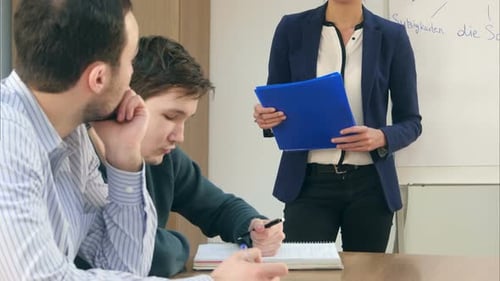 Group of Young People Studying in University Sitting in Auditorium During Lecture