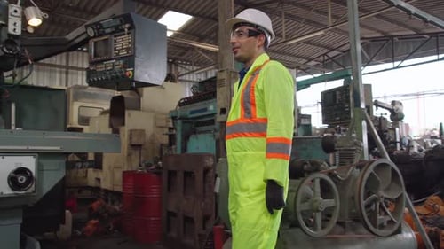 Factory Workers Handshake with Team Member in the Factory