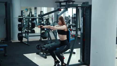 Fit Woman Training on Butterfly Weight Machine