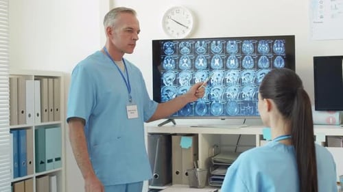 Two Doctors Analyzing X-ray Image