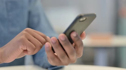 African Man Hands Using Smartphone Close Up