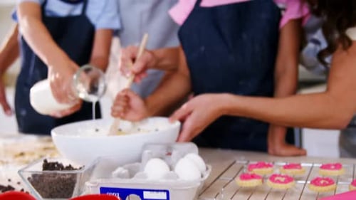 Family Baking Cookies Together in Bright Kitchen