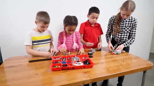 Young Friends Using Building Kit
