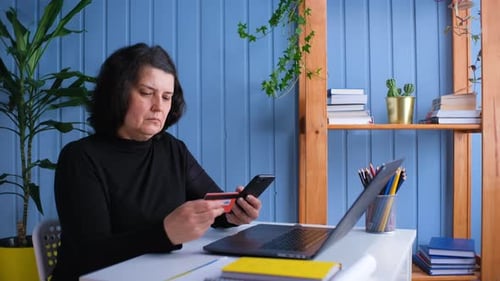 Woman Purchases Online with Credit Card and Smartphone
