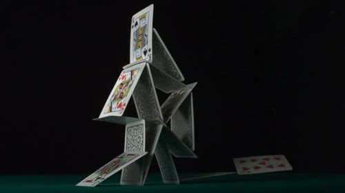 House of Cards Collapsing in Slow Motion