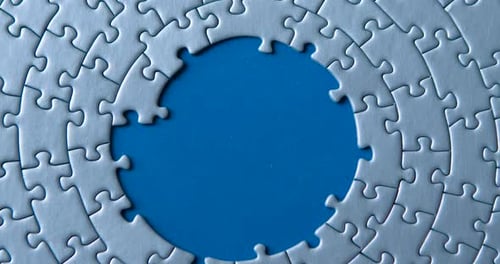 Grey puzzles isolated on blue background. Social issue concept