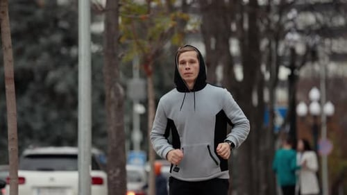 Man Jogging in a Park