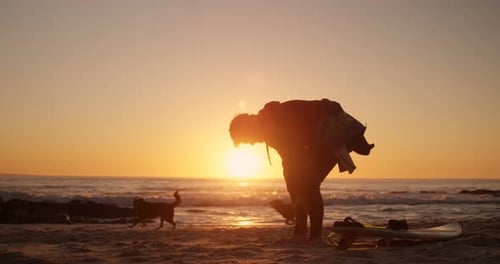 Man wearing wetsuit in the beach 4k