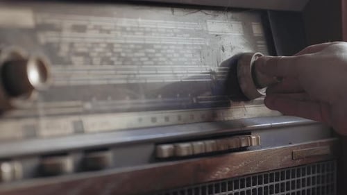 Hand Tuning a Vintage Radio Dial Close-Up