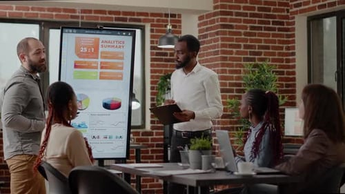 Adults in Corporate Meeting Presenting Analytics