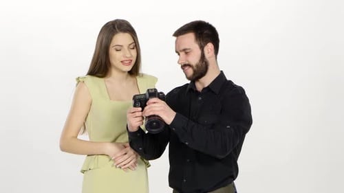 Young Adults Looking at Digital Camera Screen