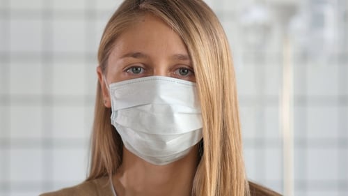 Woman Wearing Face Mask in Hospital Close Up