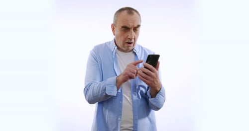 Man Using Smartphone, Confused Gesture, Against White Background