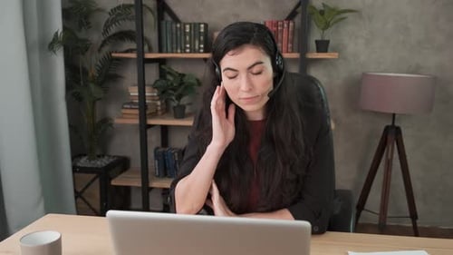 Young Woman in Virtual Meeting in Home Office