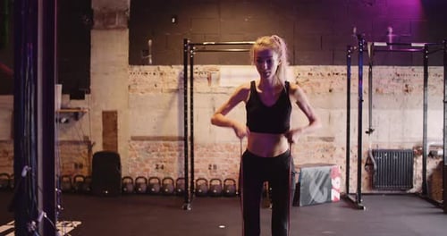 Slim Beautiful Woman Doing Workout At Health Studio