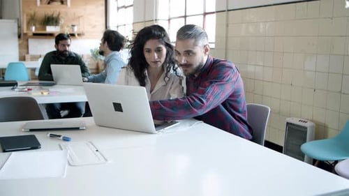 Teamwork in a Modern Office With Laptops