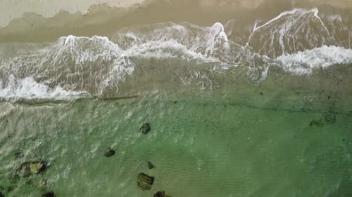 Aerial View of Sandy Beach and Sea Waves