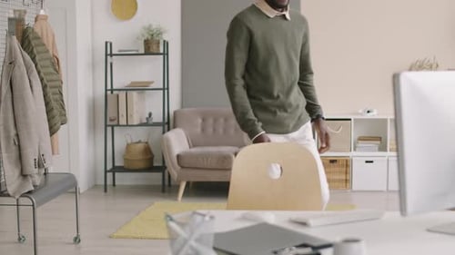 Man Working at Computer in Bright Modern Office