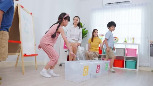 Caucasian beautiful woman teacher teaching a lesson to kid at school.