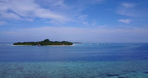 Luxury above island view of a sandy white paradise beach and blue water background