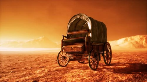 Vagón retro cubierto de lona en el desierto al atardecer