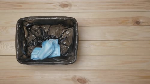 Used Masks. Bin with Medical Waste. Discarded Surgical Masks. Mask To the Trash Can. Used Medical