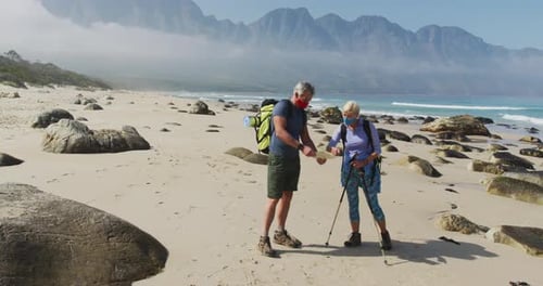 Senior Couple Hiking on a Scenic Beach